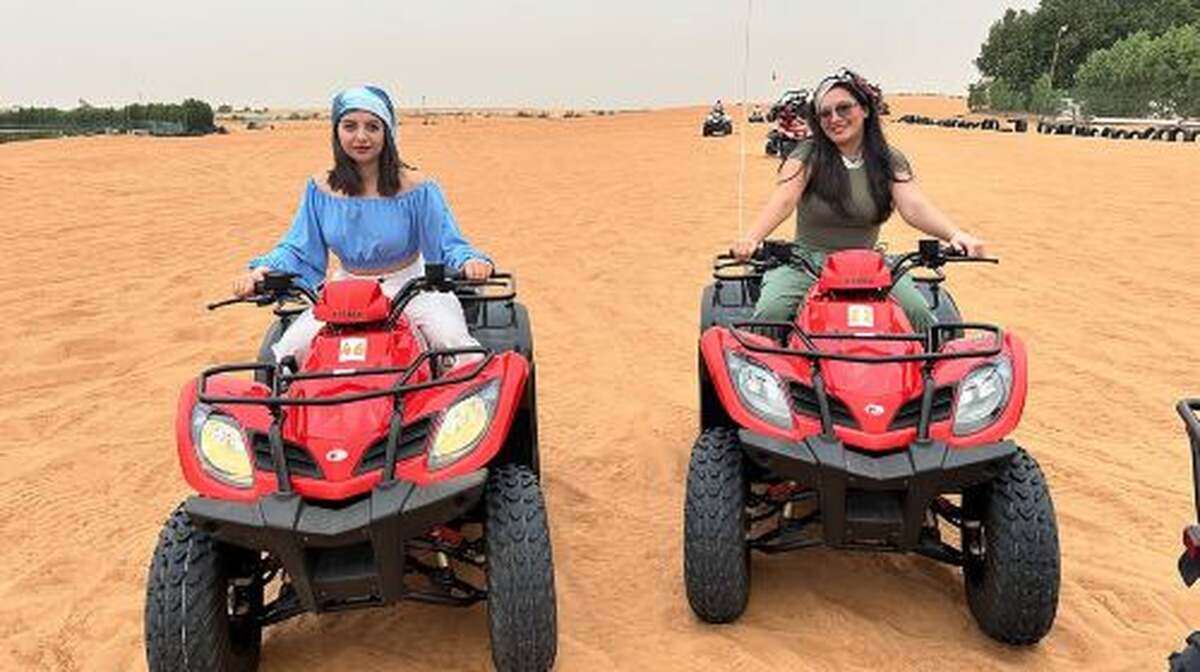 Red Dunes Safari Dubai Quad Bike Camel Ride Sandboard &BBQ Dinner Day Tours - Main Image