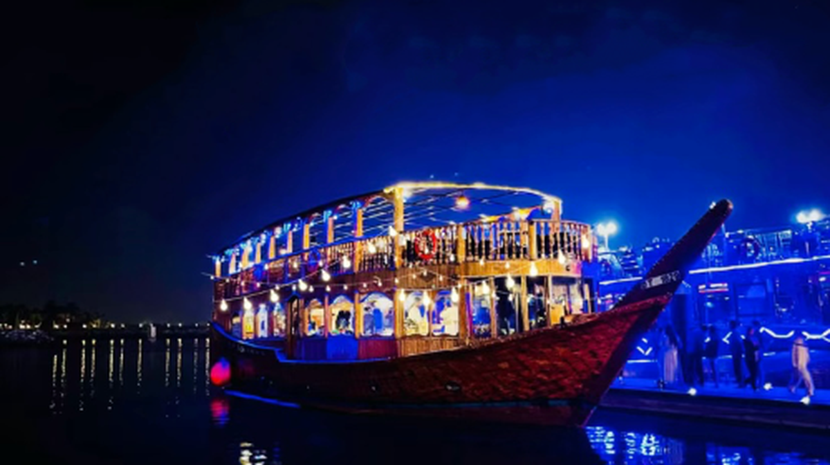 Dubai Creek night cruise with riverside views, buffet dinner, Tanoura show, optional transfers/upper deck seating Transport Passes - Main Image